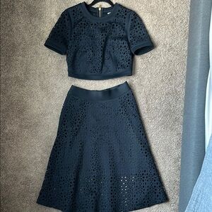 DKNY Elegant Navy Skirt Set with cropped top. Gold zipper up back.